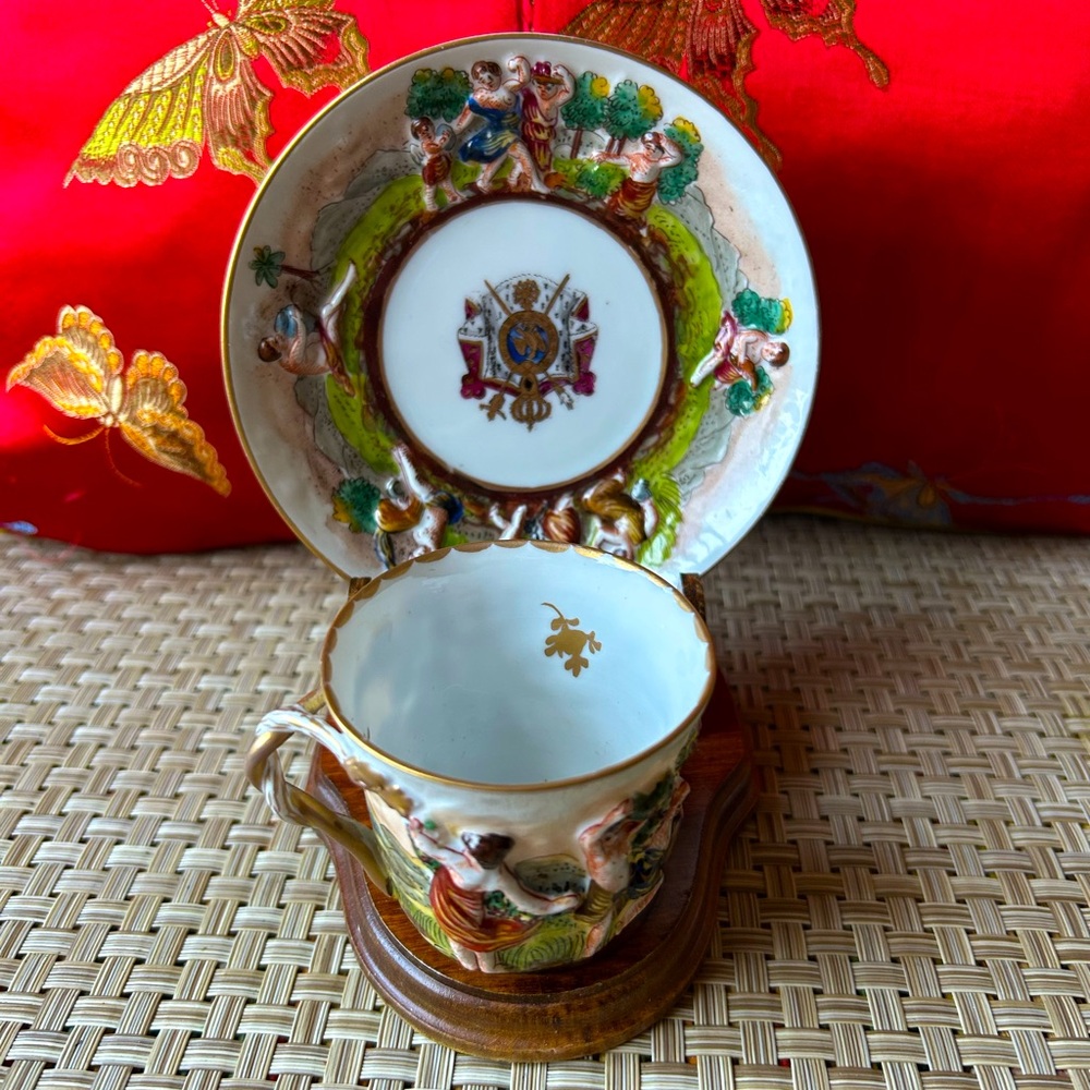 CAPODIMONTE Antique Italian Demitasse chirub cup, and saucer set.